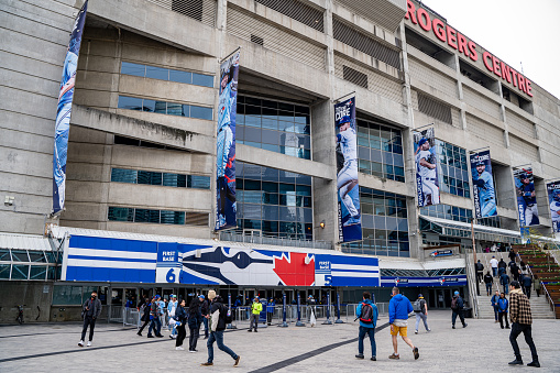 Toronto Blue Jays fans at the entrance of Rogers Centre. Toronto, Canada - April 29, 2024.