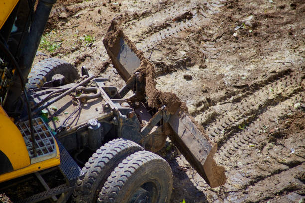 istock The bulldozer bucket at work on earthworks close-up, construction work with a bulldozer, bulldozer work, preparation of the main road canvas by a bulldozer 2151102148