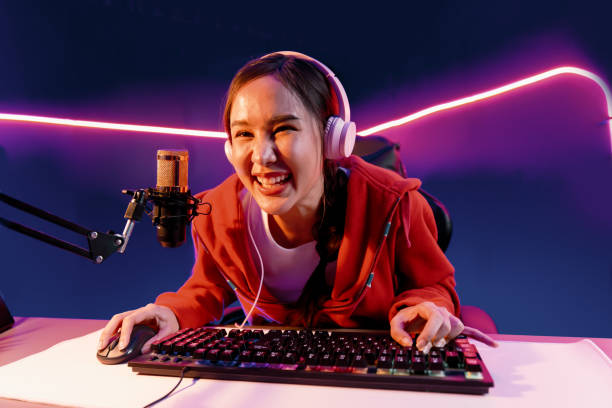 istock Host channel smiling Asian wearing headphone recording on phone. Stratagem. 2151103779