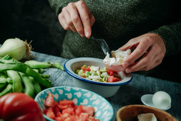 istock preparing a salad from andalusia with broad beans 2151105138