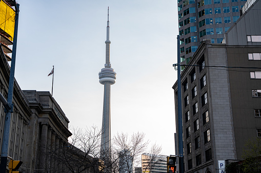 View of the CN Tower from Front Street. Toronto, Canada - April 29, 2024.