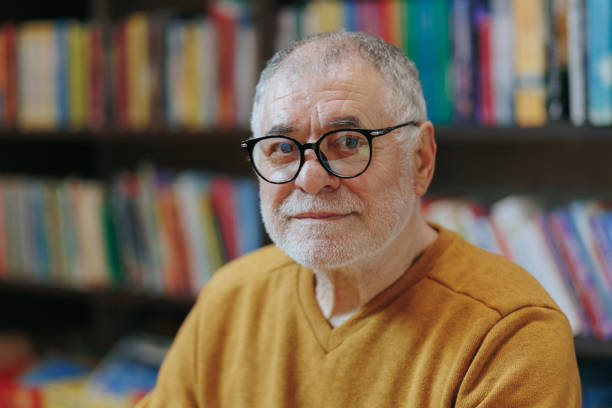 istock Intellectual Perspective Front View Portrait of Aged Man in Library 2151110718
