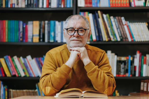 istock Pages of Insight Front View of Senior Man in Library Environment 2151110774