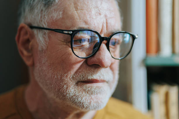 istock Pages of Experience Front View of Wise Elderly Man in Bookstore 2151110789