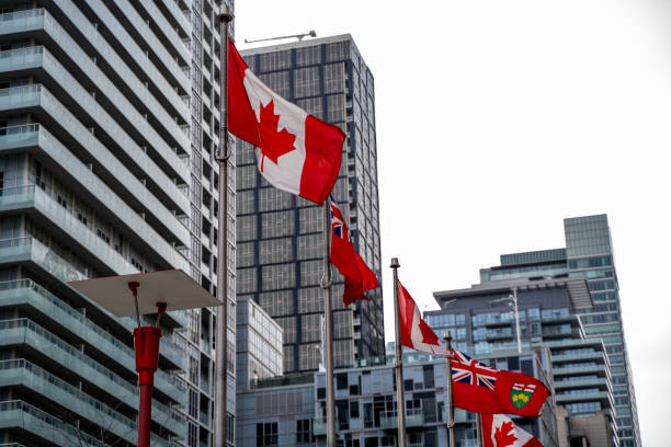 istock Canadian and Ontario flags in Toronto Downtown. 2151110902