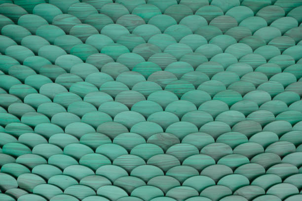 Green wooden fish scale facade and background. Has a three dimensional depth to it.