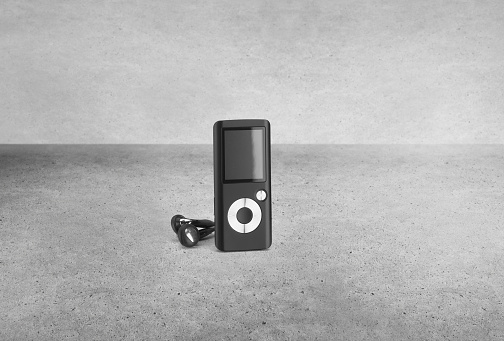 Retro MP3 player on a concrete background