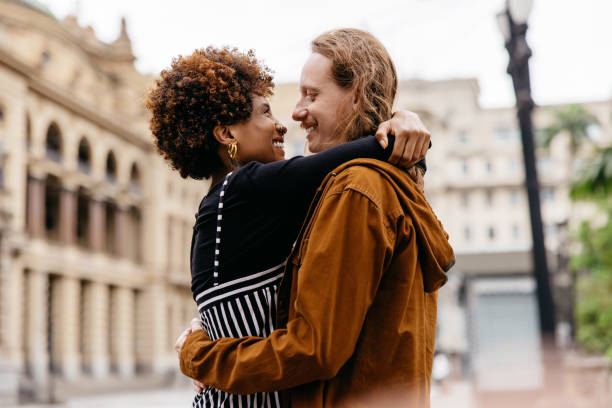 istock Intimate embrace on a city walk, couple showing affection 2151117233