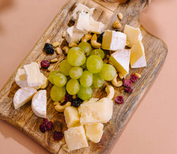 istock Gourmet cheese platter on wooden board 2151117835