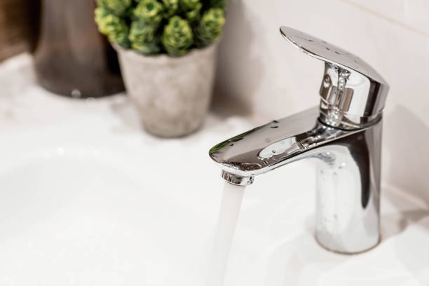 istock Modern bathroom interior with sink and faucet. Hot water shutdown schedule. A concept for a plumbing store. Decor, bathroom details. 2151118935