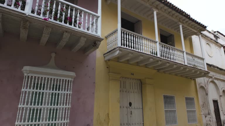 Quaint Cartagena street adorned with blooming balconies and colonial architecture, Colombia