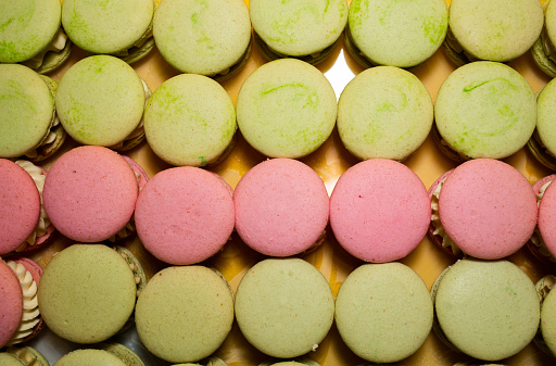 collection of colorful French macarons are next to each other on a white background