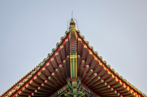 Roof ridge of an ancient Chinese temple against the sky.