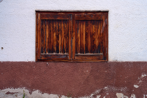 Val Manez in Italy. Old door in warm tone wood