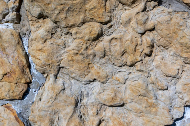 Beautiful old stone background of textured stone on the wall.
