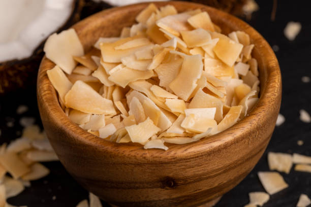 istock sweet orange and yellow coconut flakes fried in sugar 2151127618