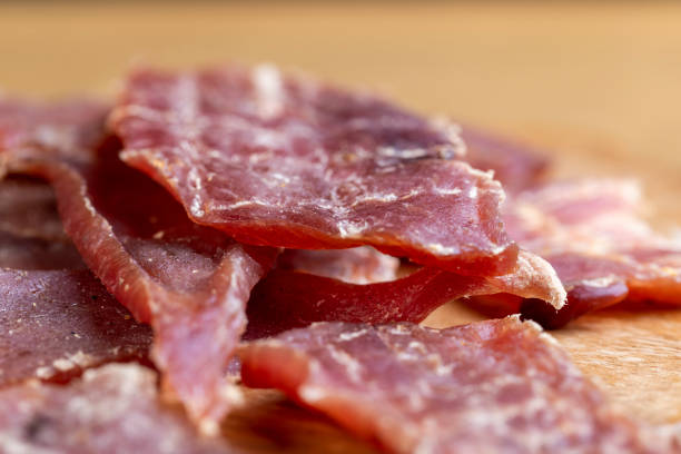 Beef Bacon slice served in plate isolated on wooden table top view of indian food