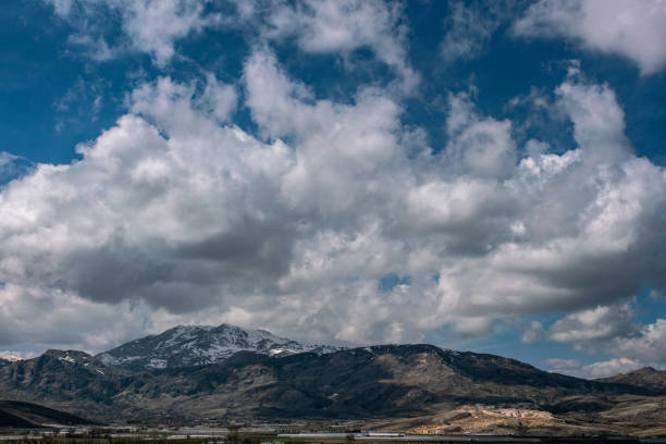 Beautiful summer landscape. Majestic mountains and white clouds