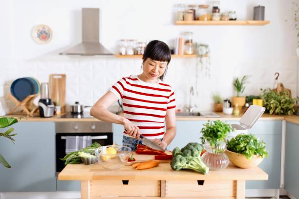 istock Woman preparing healthy food 2151129492