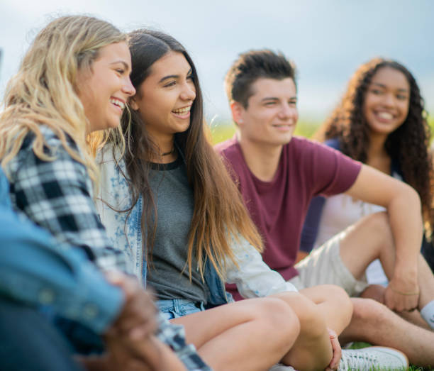 istock Teens Hanging Outside Together 2151129818