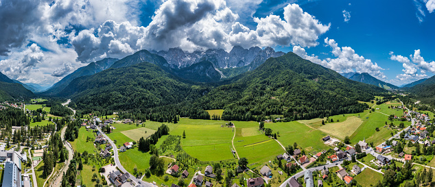 Gozd Martuljek town in Slovenia at summer with beautiful nature and mountains in the background. View of mountain landscape next to Gozd Martuljek in Slovenia, view from the top of Gozd Martuljek.