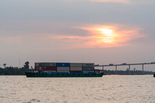 Photo of cargo ship sailing on Tien River and Rach Mieu bridge, My Tho city, Tien Giang province