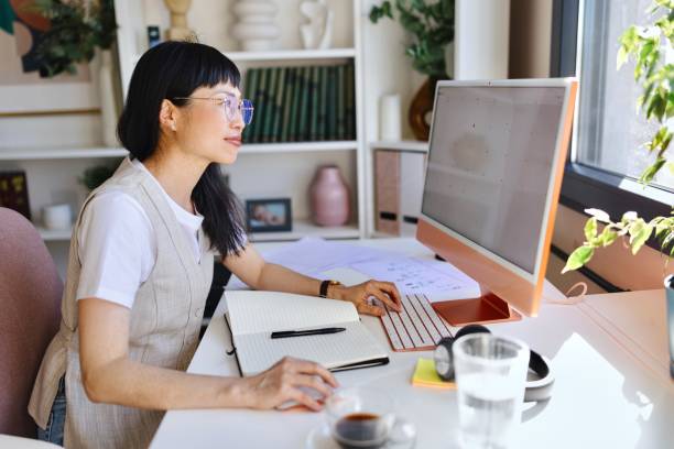 istock Modern female person working from home 2151131232