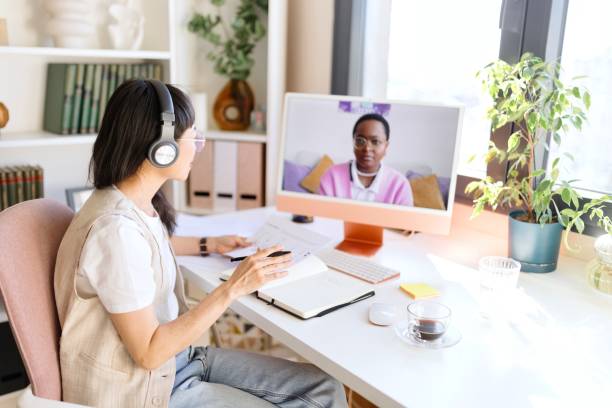 istock Beautiful female having a video call while working from home 2151131290