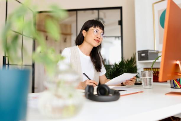 istock Japanese woman working from home 2151131374