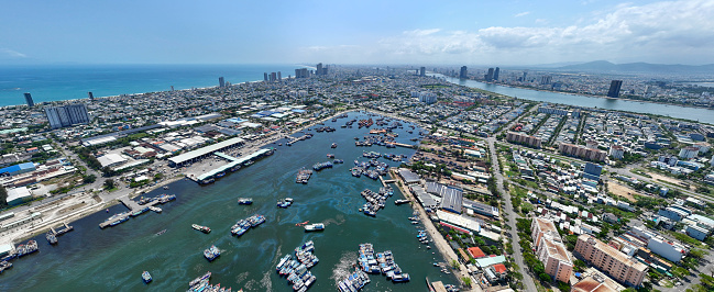 Drone view of Da Nang city port where fishing boats are moored and diesel pollutes the ocean