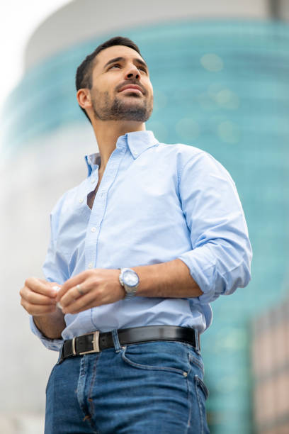 istock Cosmopolitan handsome man posing at camera in the city 2151134394