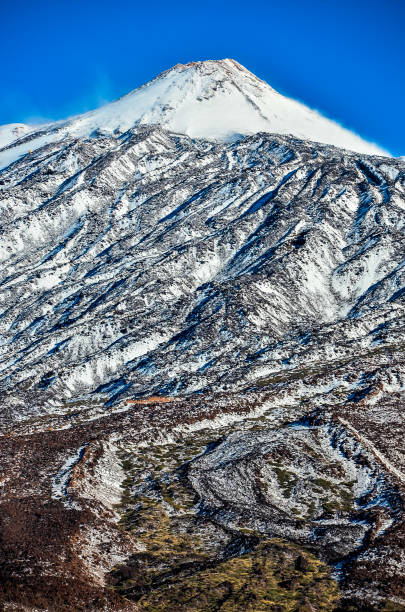 istock A snow covered mountain with a peak that is visible in the distance 2151135829