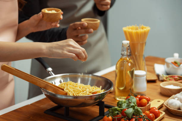 istock Close up hand couple influencers cooking spaghetti mix ingredient. Postulate. 2151137046