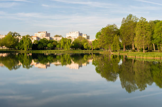 Long exposure shot of the Boating Lake and a public park in Ajka in the morning in springtime.