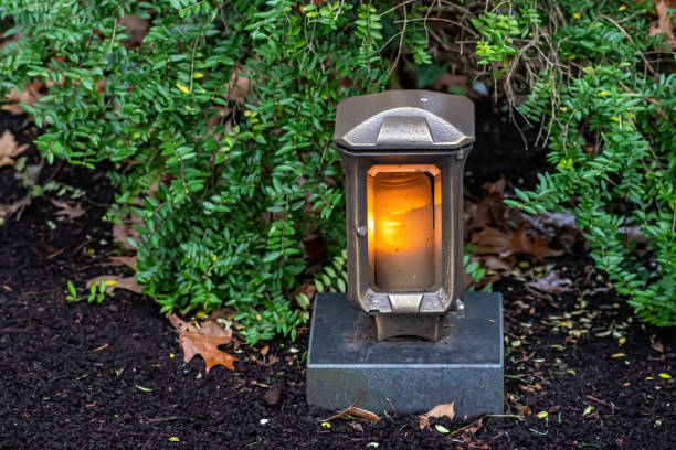 istock Grave decoration with candle and flowers 2151142878