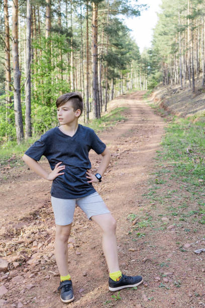 Portrait of happy boy in forest.