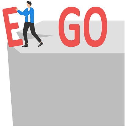 Businessman change EGO to GO text on top mountain, motivation, achievement and goal concept