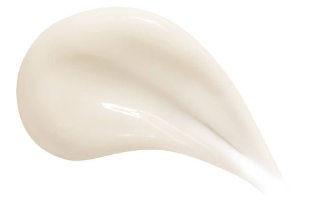 istock Smear of beautiful yellow cream on an empty background. isolated 2151145876