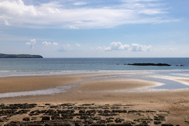 The beach at Bigbury on the Devon coast, with a blue sky overhead