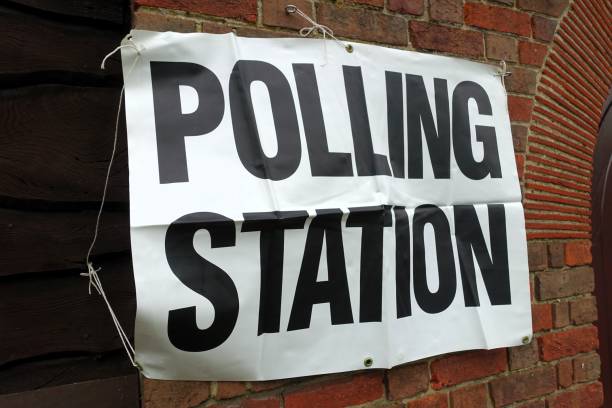 istock UK polling station sign attached to community hall wall 2151146821