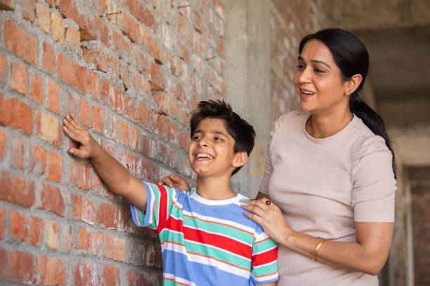 istock Happy mother with son visiting construction site 2151148338