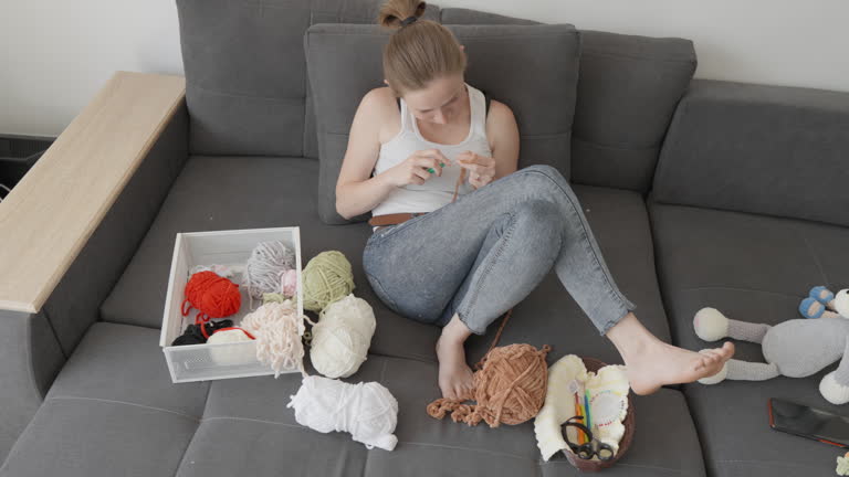 Video process of creating amigurumi toys in a relaxing home atmosphere, where each thread turns into an incredible creation of future homemade tied toys. Leisure at home