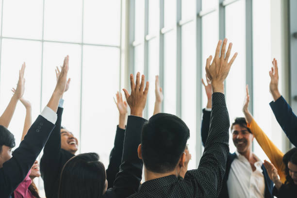 istock Successful business people raised their hands up for voting. Intellectual. 2151152245