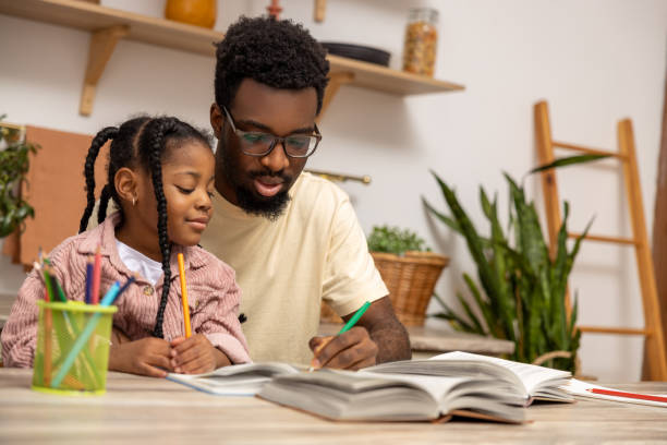 istock Happy father helping schoolgirl daughter studying 2151153087