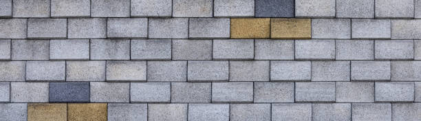 istock Banner is a row of concrete grey blocks. Inserts of yellow blocks 2151156502