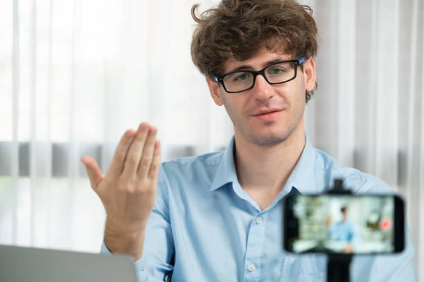istock Host channel of influencer using smartphone blurred image focusing face. Gusher. 2151156635