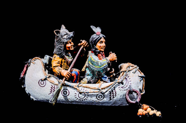 North American Indian Canoe Statue on a Black Background