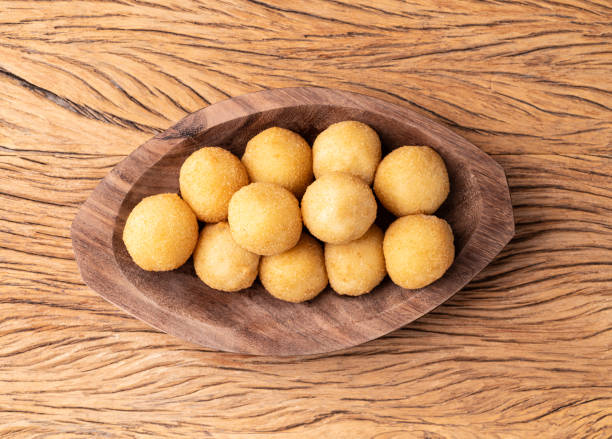 istock Typical brazilian snack cheese ball on a plate over wooden table 2151158340