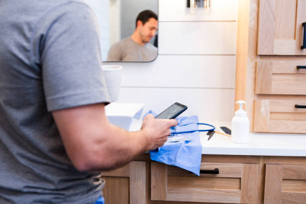 istock Unrecognizable male doctor checks his social media while getting ready for work 2151158456