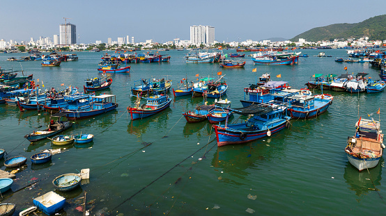 Drone view of fishing boats are nailing by the fish farm Nha Trang city, Khanh hoa province, central Vietnam